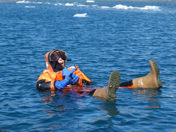 Moran floating in a special suit built for cold water immersion.