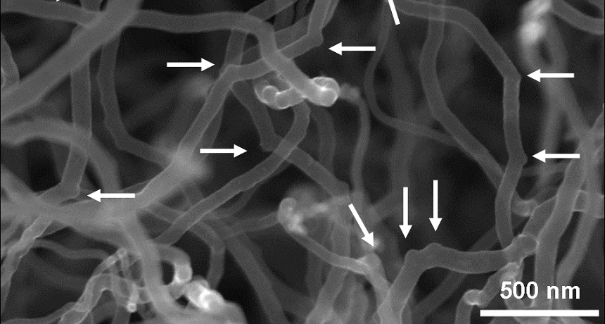 Arrows point to elbows created in carbon nanotubes in this close-up of a nanotube sponge. The elbows are created by boron atoms, and give the material its sponginess.