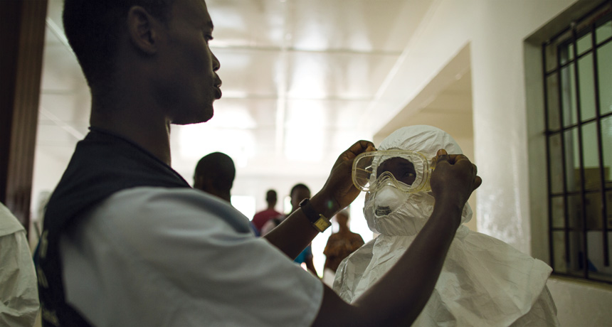 health care workers putting on protective gear