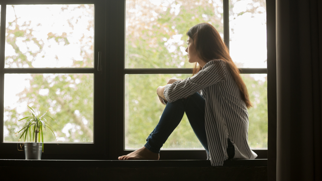 girl looking out window