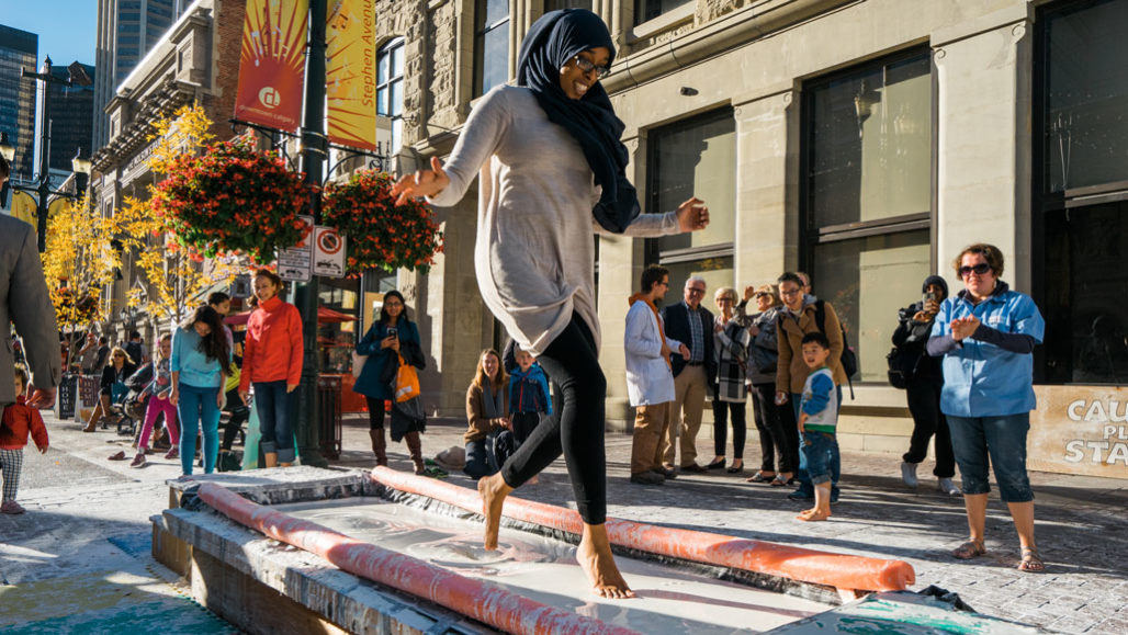 woman running barefoot across pit of ooblek