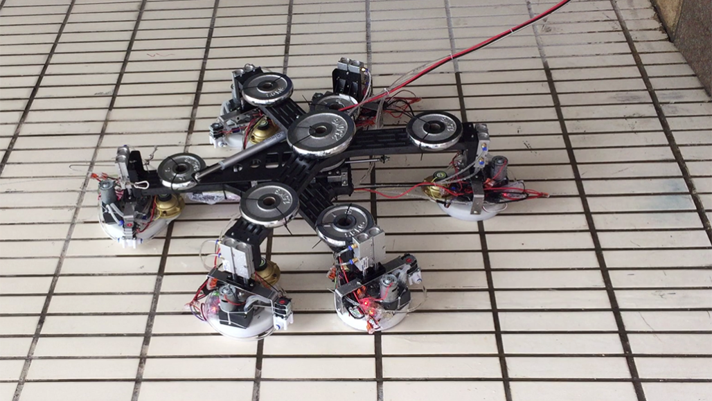 a photo of a robot that climbs walls with the use of suction cups