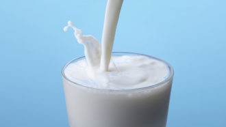 a photo of milk being poured into a glass