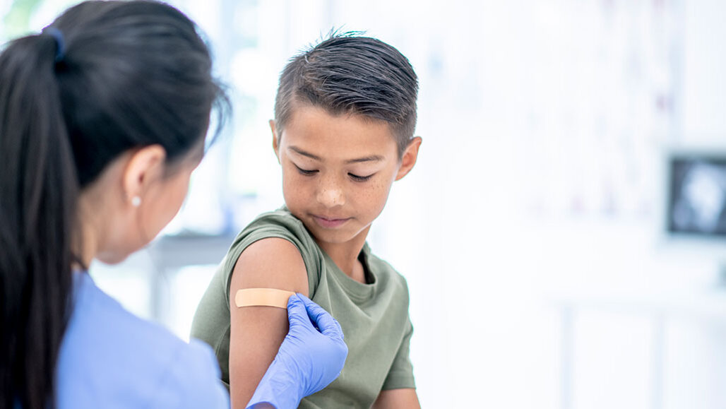 a photo of a young man after getting a shot