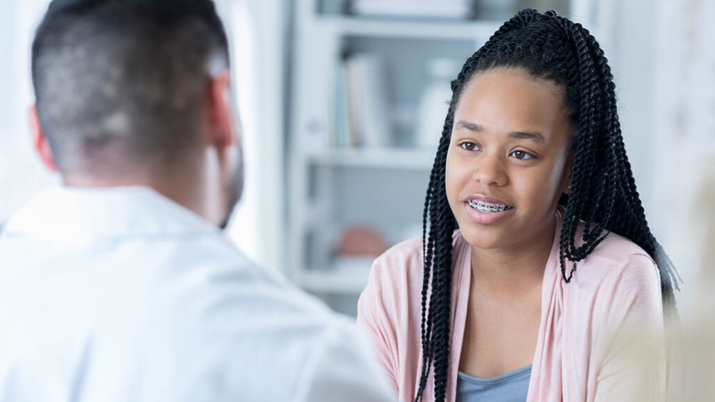 a teenage girl with a doctor