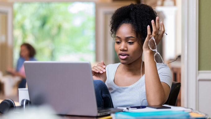 a young woman doing online homework