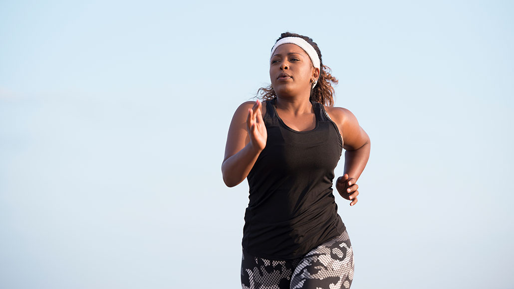 a photo of a Black woman running
