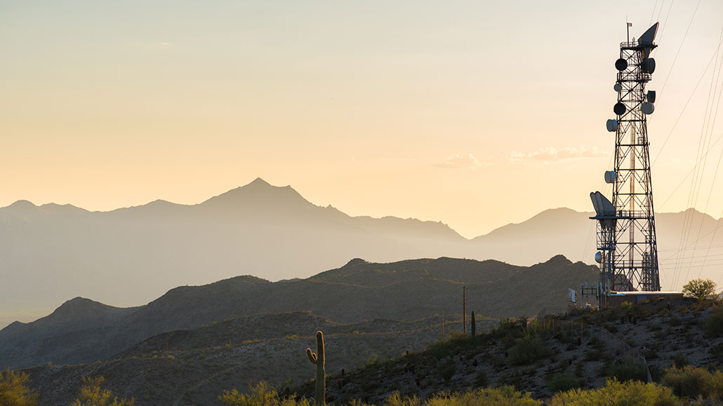 a photo of a large cell tower in a desert