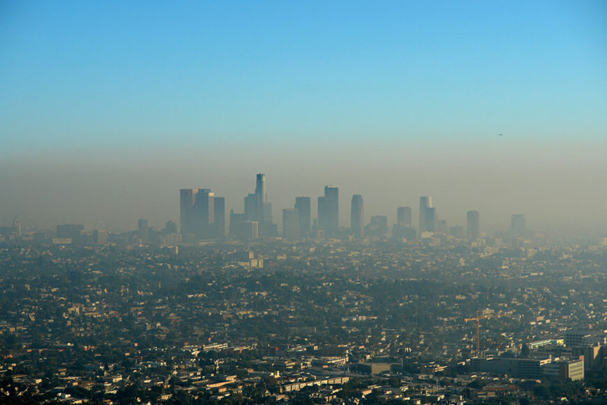 a thick brown haze of smog hangs over the LA skyline