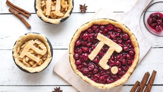 a large cherry pie decorated with a π symbol made from crust