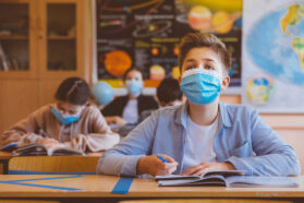 masked kids in a classroom