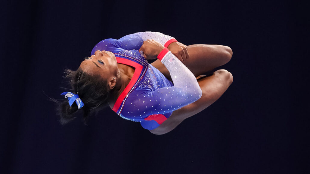 gymnast Simone Biles twists through the air