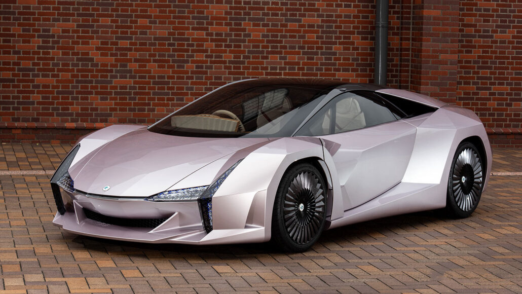 a photo of a sporty looking car parked on a brick driveway with a brick wall behind it