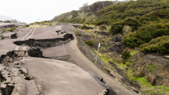 a road in a rural area is fractured by an earthquake
