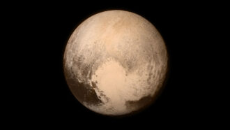 a photo of Pluto taken by the New Horizons spacecraft shows the dwarf planet's heart-shaped glacier