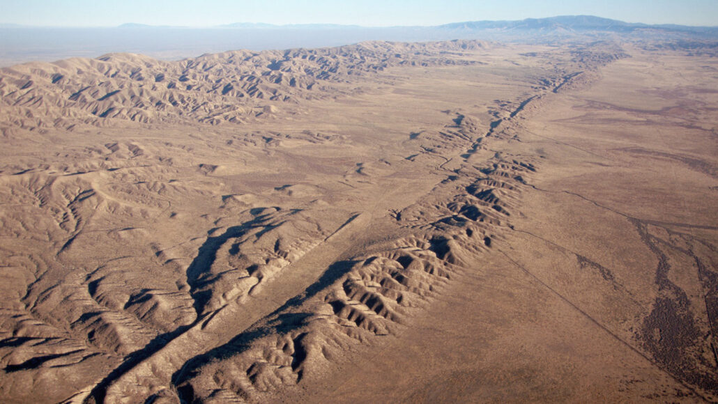 the San Andreas fault appears as a ridge across flat, brown terrain