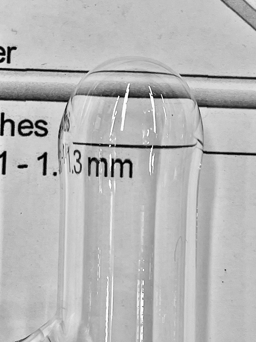 a photo of a small rounded end of a glassware tube
