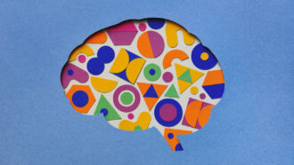 in the center of a blue piece of paper is a cut out of a brain, which contains a colorful jumble of different shapes