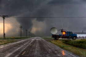 Scientists in a Doppler on Wheels radar truck scan a tornado near Dodge City, Kansas with doppler radar, May 24, 2016.