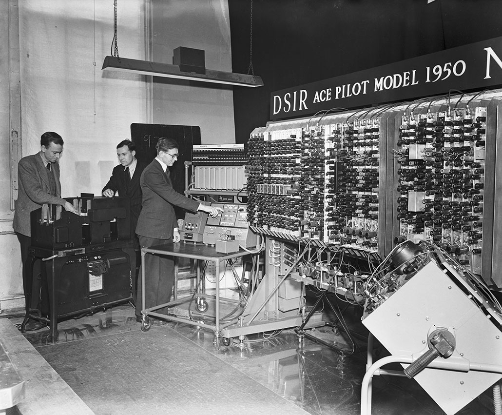 a black and white photo showing a 1950 British computer based on Turing's original design.