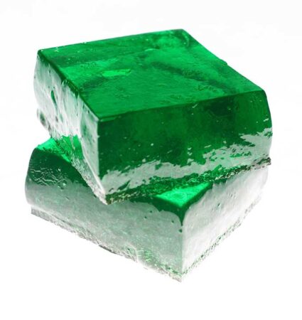 two rectangular slices of bright green Jell-O stacked one on the other