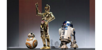 Three droids, BB-8, C-3PO and R2-D2 on a stage
