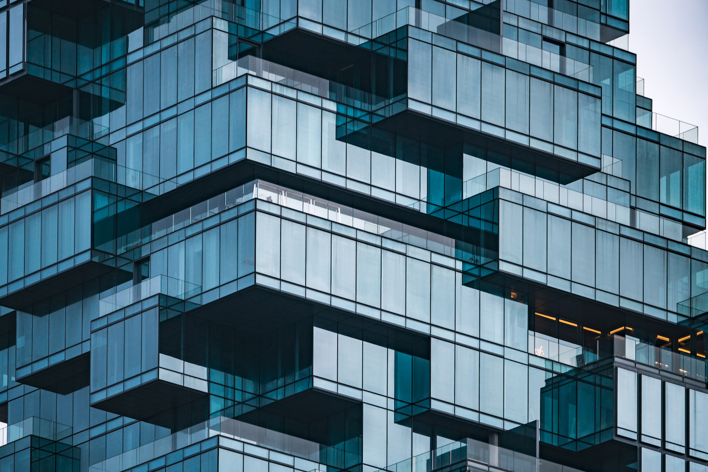 the side of a skyscraper is completely covered in windows