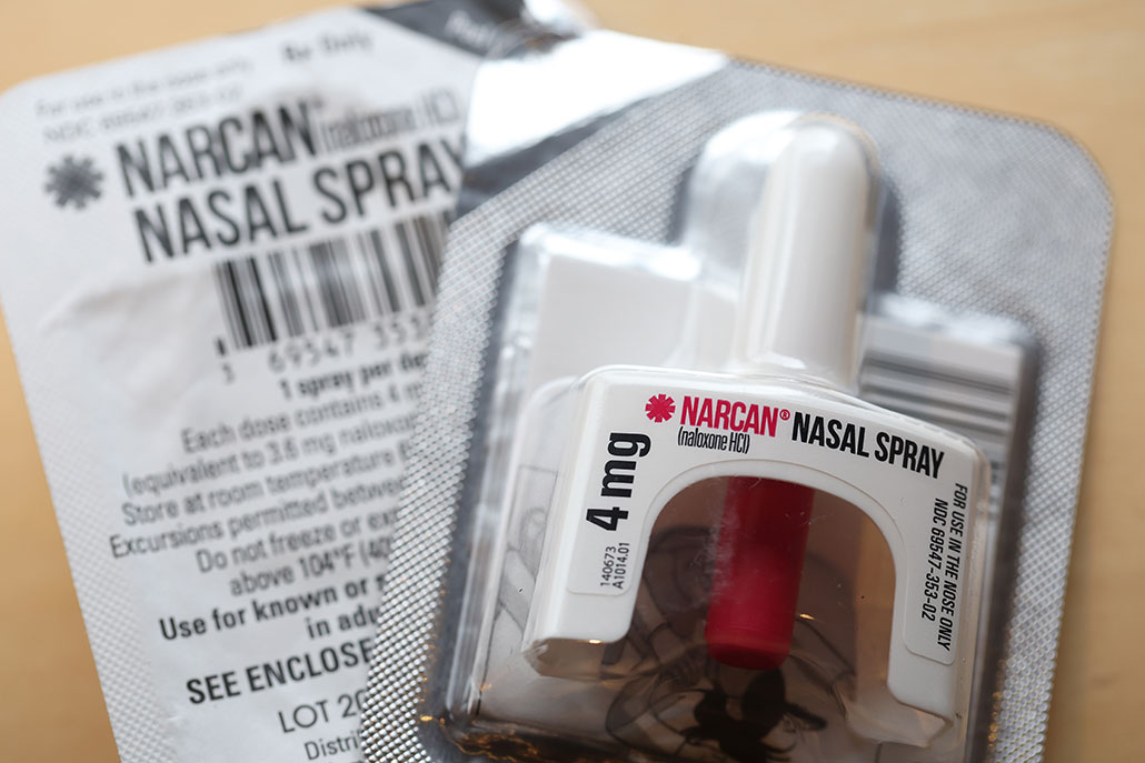 a photo of Naloxone nasal spray, a nasal spray in a foil packet