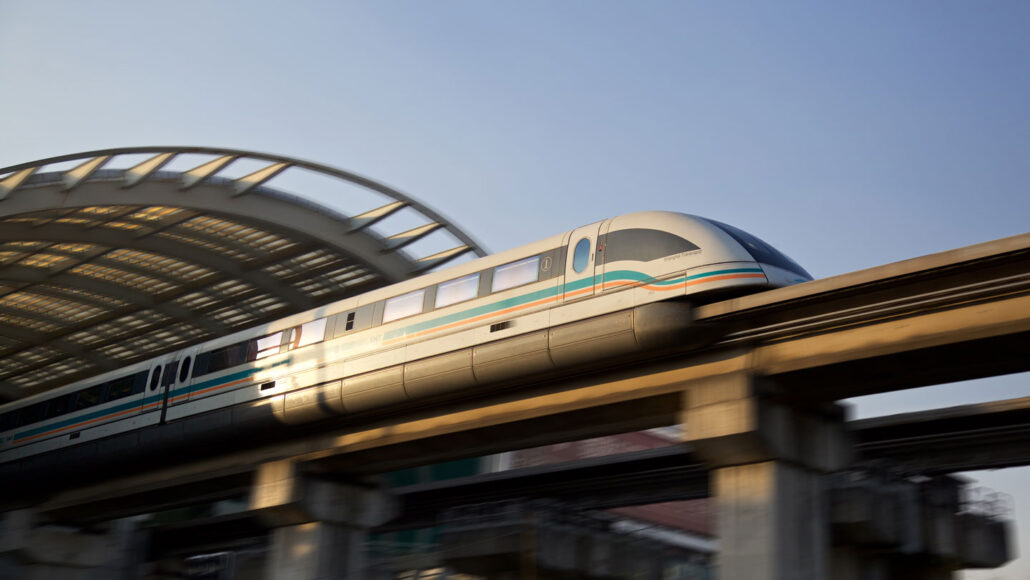 a photo of a maglev train leaving a train station
