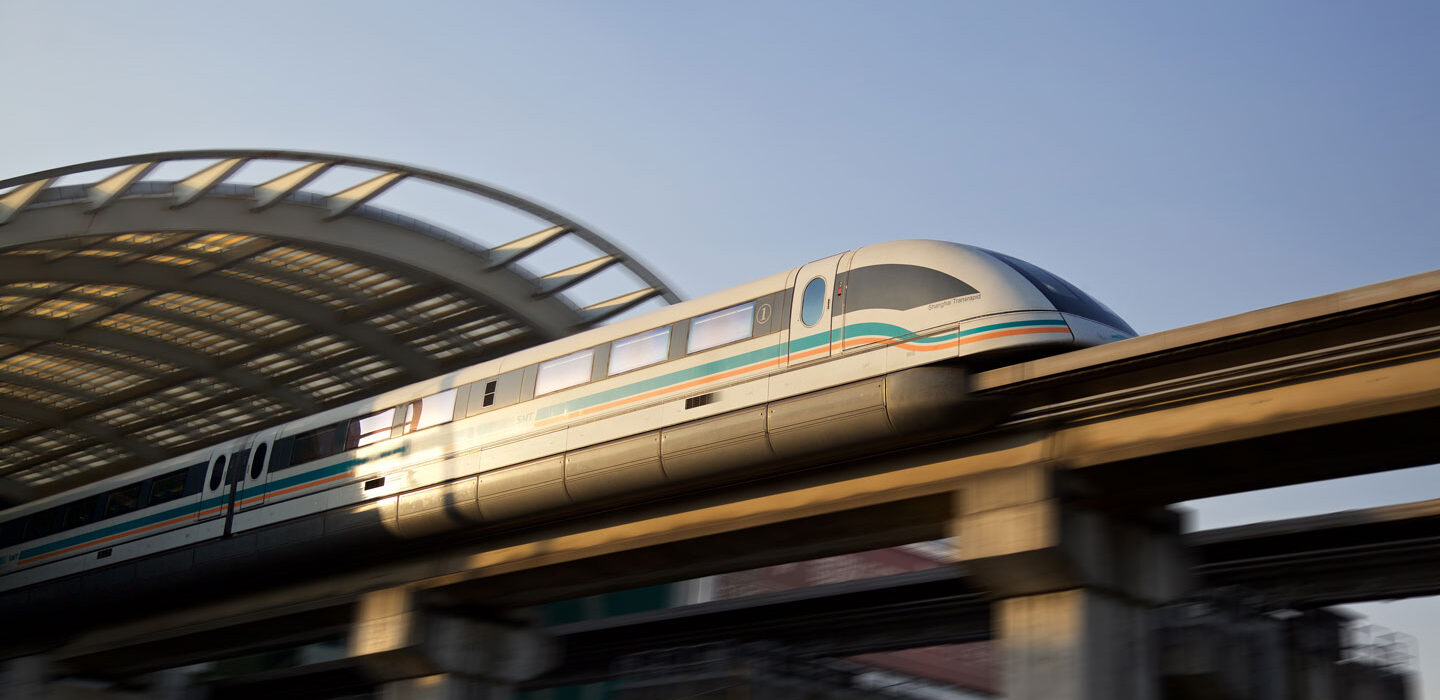 a photo of a maglev train leaving a train station