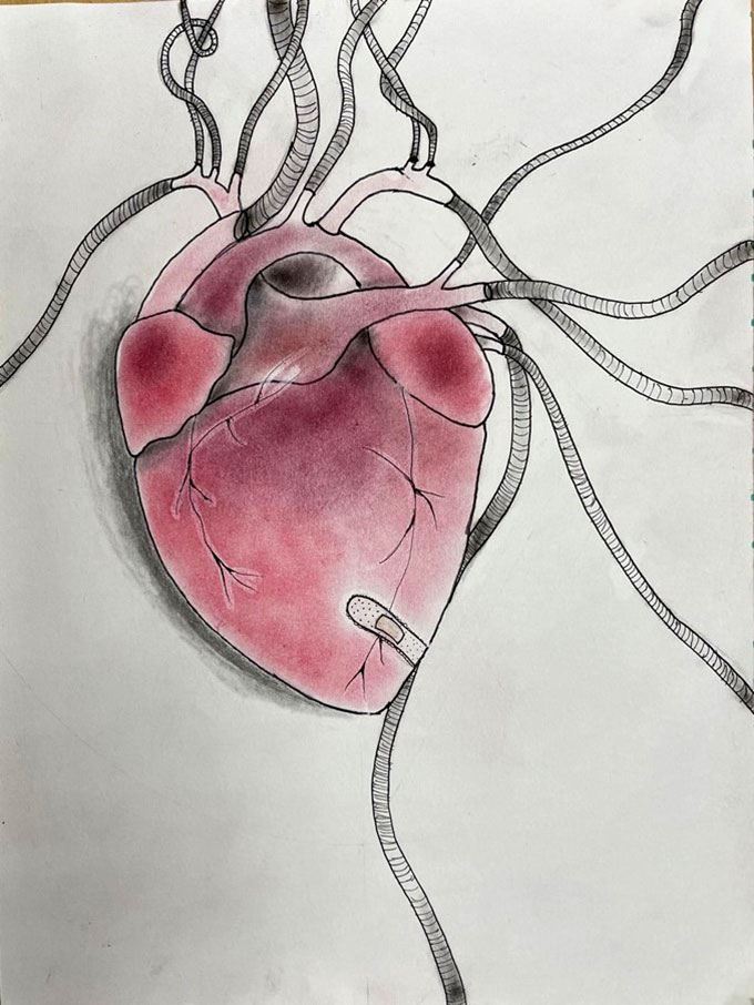 a heart is drawn and shaded in pencil and pink colored pencil