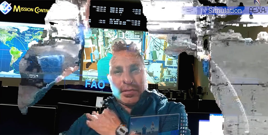 A view of an astronaut holoporting from the ISS to NASA's Mission Control during a simulation