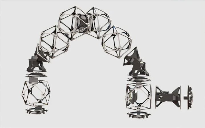 Six metal voxels are connected to form an arching inchworm like robot.