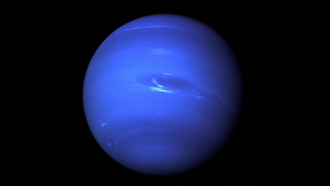 A cobalt blue Neptune against a black background