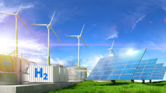 a solar and wind power plant with H2 storage containers outside the building