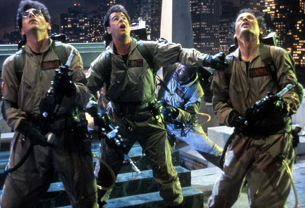 a scene from the original Ghostbusters movie, where all three Ghostbusters are in gear and looking above them in surprise