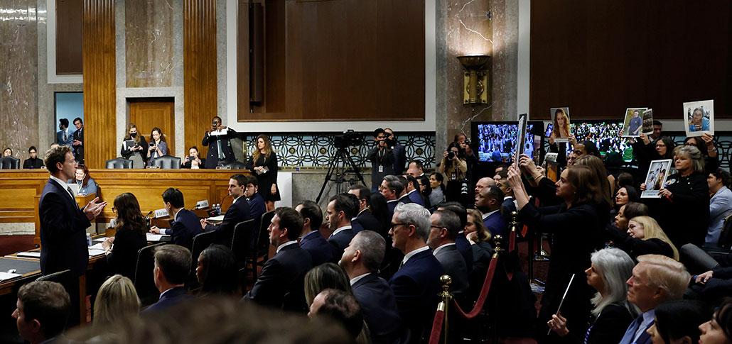 a photo of Mark Zuckerberg adressing families and advocates at a Senate hearing