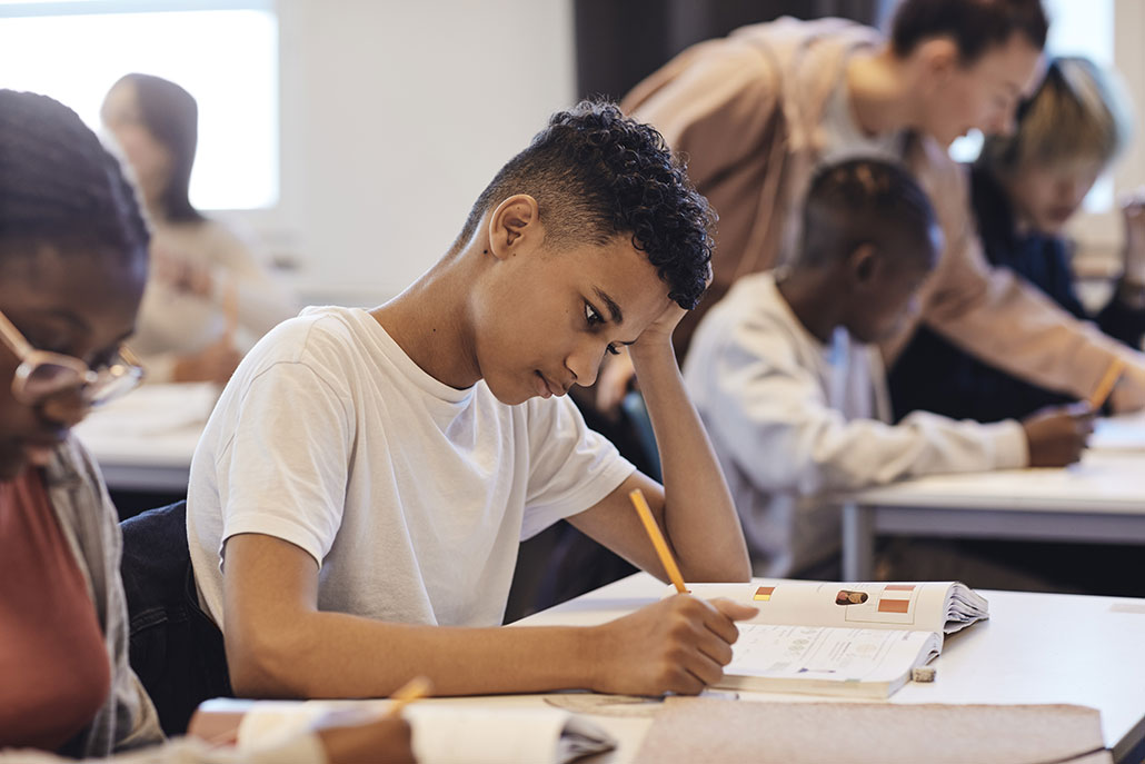 kids in a classroom working hard