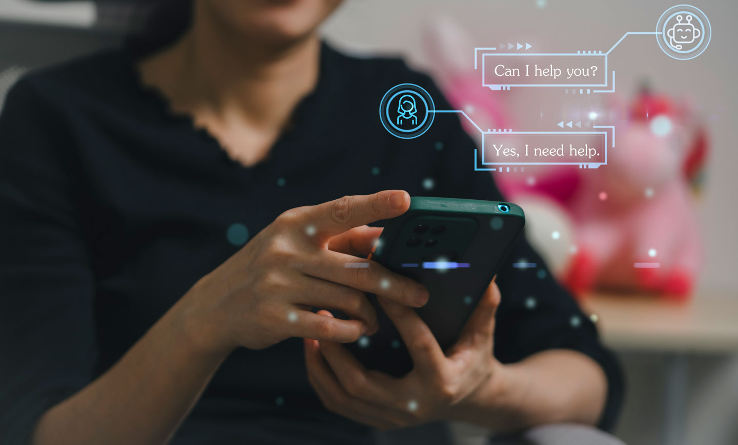 a person holds their smartphone in their hands, and above the phone a graphic shows the conversation they're having with a chatbot; the chatbot says "can I help you?" and the person says "yes, I need help"