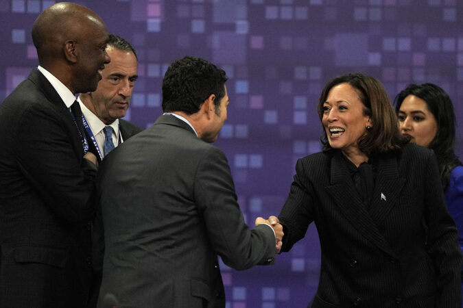 a photo of Kamala Harris greeting other delegates