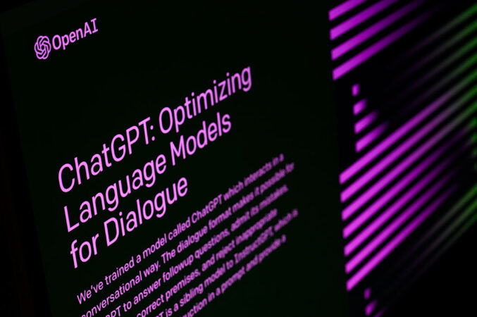 a side view of purple text on a black screen reading 'ChatGPT:  Optimizing Language Models for Dialogue'