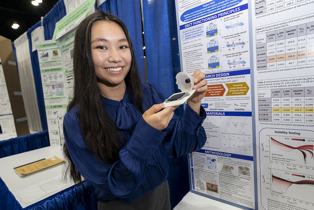 a photo of Grace Sun holding her organic electrochemical transistor