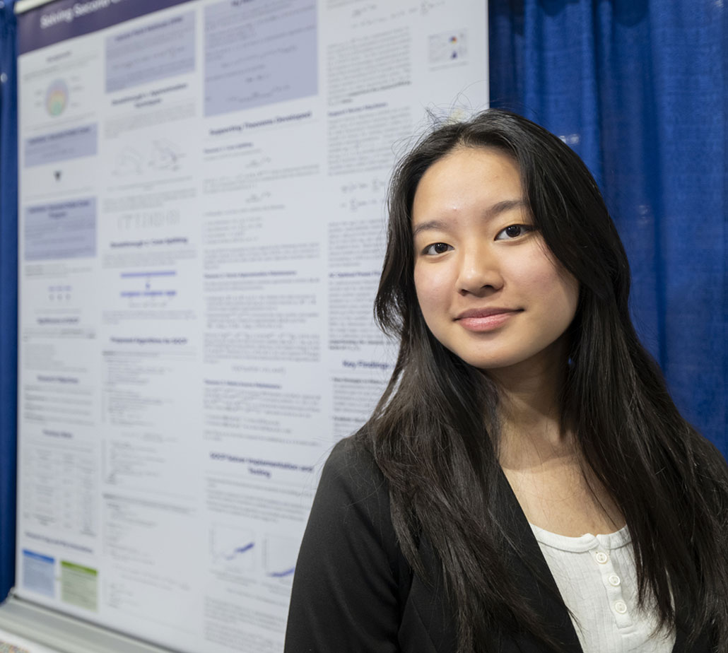 Michelle Wei standing in front of her project board