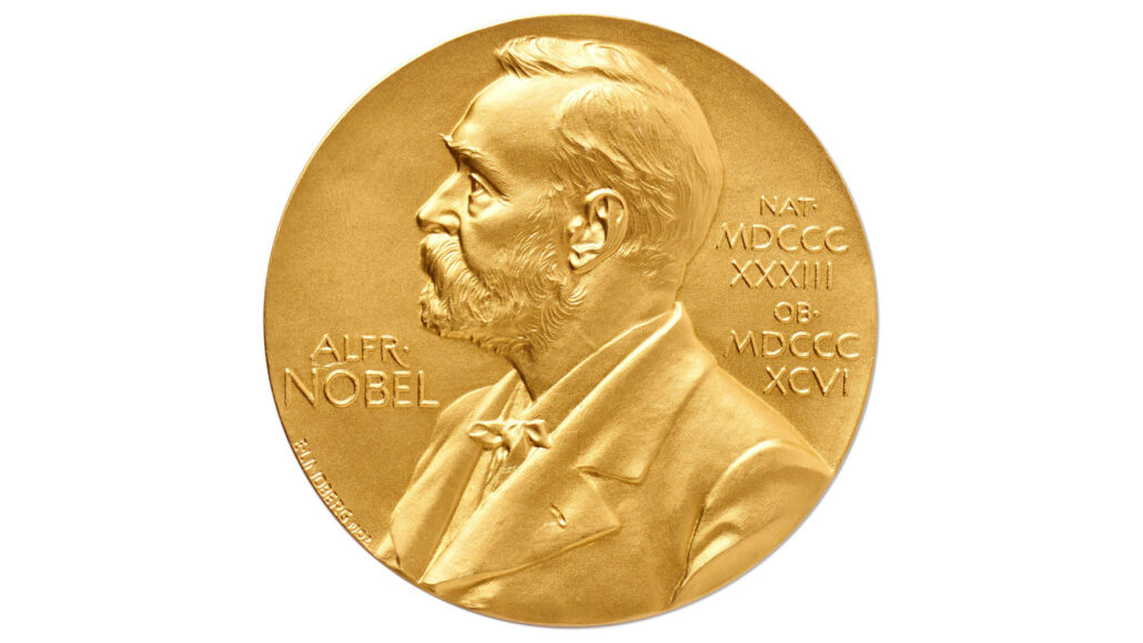 a photo of the front of the Nobel Prize medal against a white background