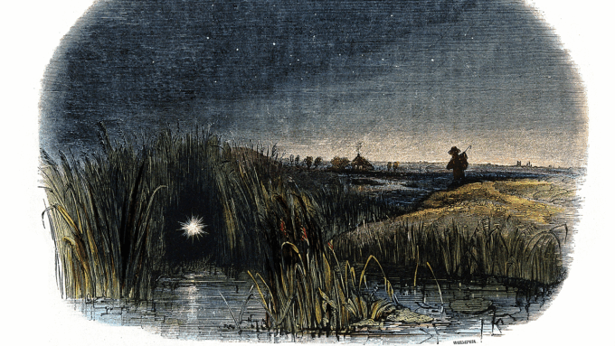 a colored wood etching showing a ghostly light, or will-o'-the-wisp, floating at the edge of a marsh as a person walks along the marsh