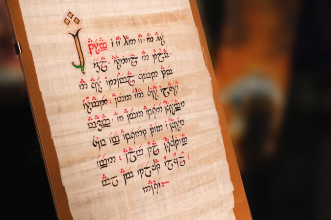 a manuscript with elvish language text written on silk parchment, created by Tolkien