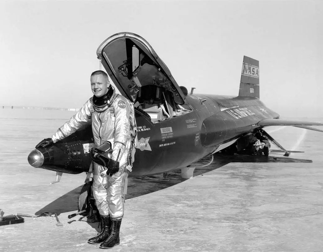 Armstrong standing in front of an X-15 space plane that he test piloted