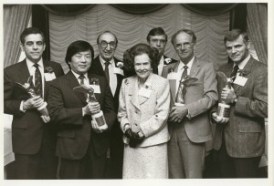 Lee Hood (far right), recipient of a 1987 Lasker Basic Medical Research Award. Other award recipients: Philip Leder (left), Susumu Tonegawa, and Mogens Schou (next to Dr. Hood). Mary Lasker is in the center. Behind her are Michael DeBakey, who was then Chair of the Lasker Awards Jury, and James Fordyce, a member of the Foundation’s Board of Directors.