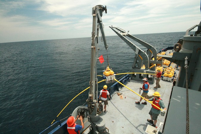 Scientists prepare to lower sensing equipment onto the Pacific Ocean floor. The equipment measured the seafloor rock’s ability to conduct electricity. They ran these tests at sites where one plate slides under another. Credit: Kerry Key, Scripps Institution of Oceanography at UC San Diego