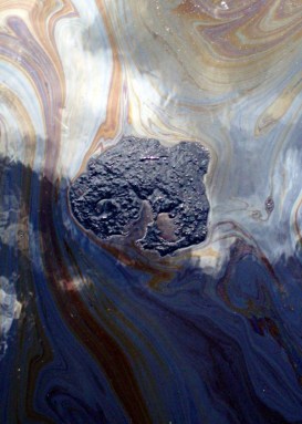 Tarry balls of bitumen floated on the Kalamazoo River in the first few days after the oil spill. Credit: Michelle Barlond Smith